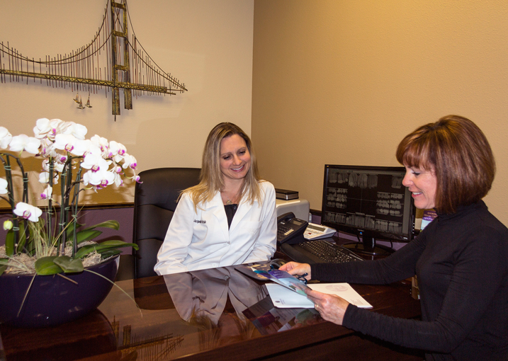 Dr. Kotula Consulting With A Patient