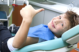 Boy Smiling in Dental Chair