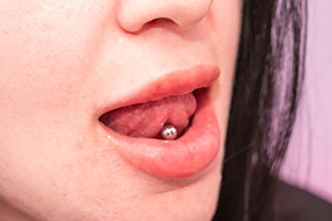Girl with Pierced Tongue